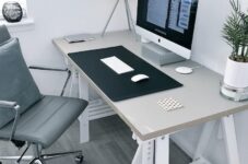 gray leather office rolling armchair beside white wooden computer desk