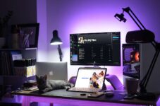 black and silver laptop computer on brown wooden table