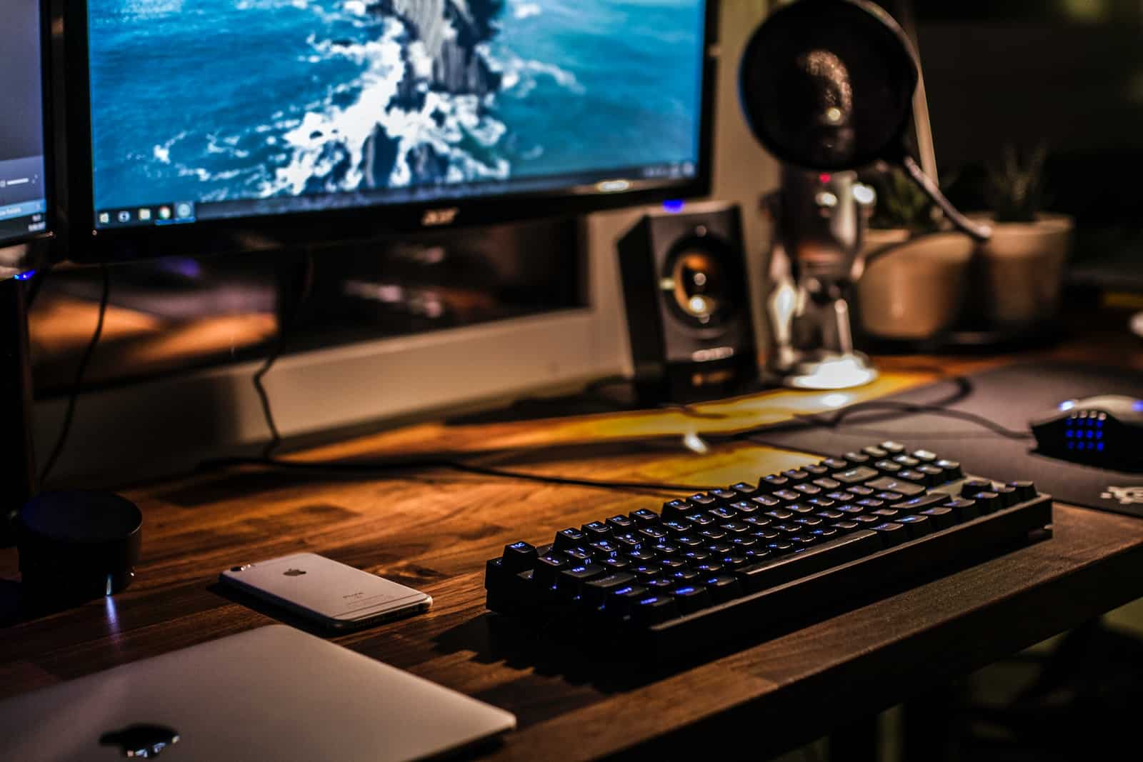 black corded gaming computer keyboard and flat screen monitor