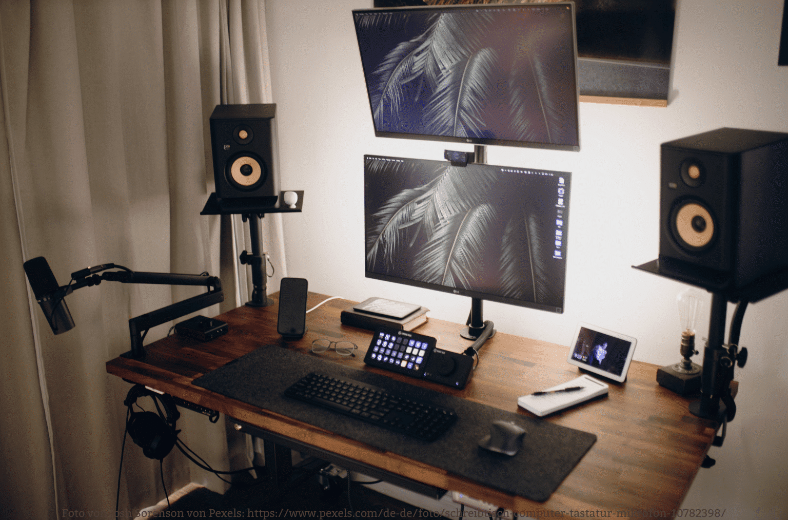 An image of a cozy, well-decorated home office with comfortable seating, ambient lighting, and audio gear integrated seamlessly, demonstrating the importance of a cozy work environment.